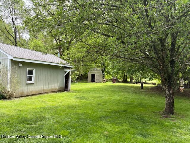 36 Blue Mountain Mnr, Saugerties, NY 12477 - view of green lawn with an outdoor structure and a shed