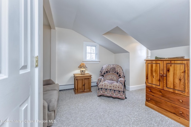 living area with vaulted ceiling, carpet, a baseboard radiator, and baseboards