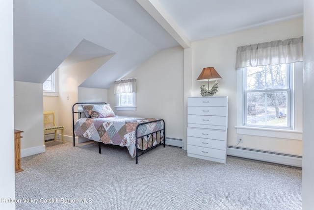 carpeted bedroom with lofted ceiling, baseboards, and a baseboard heating unit