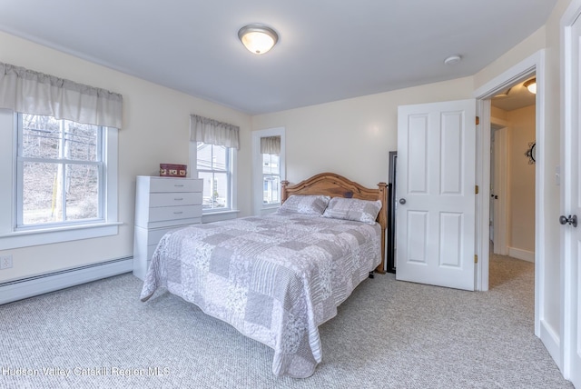 bedroom featuring a baseboard radiator and light colored carpet