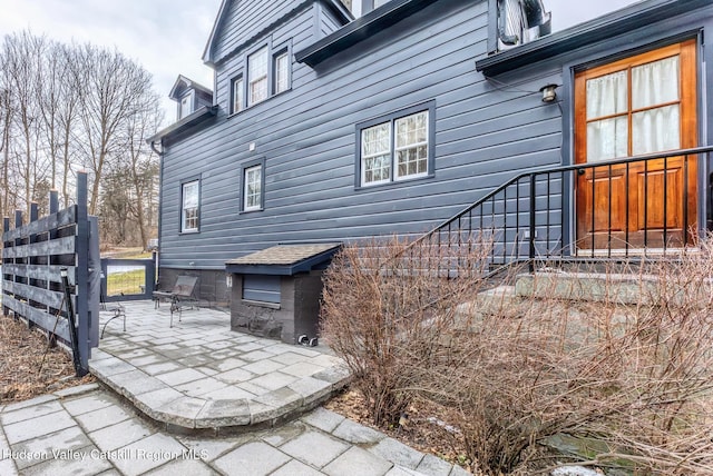 view of property exterior featuring a patio