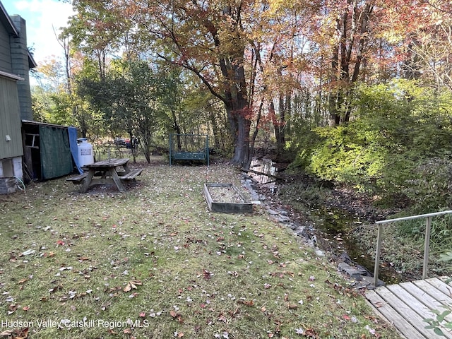 view of yard with a trampoline