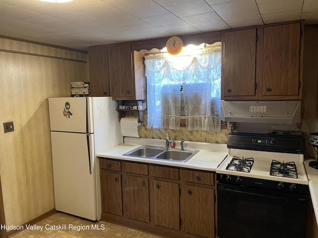 kitchen with white appliances and sink