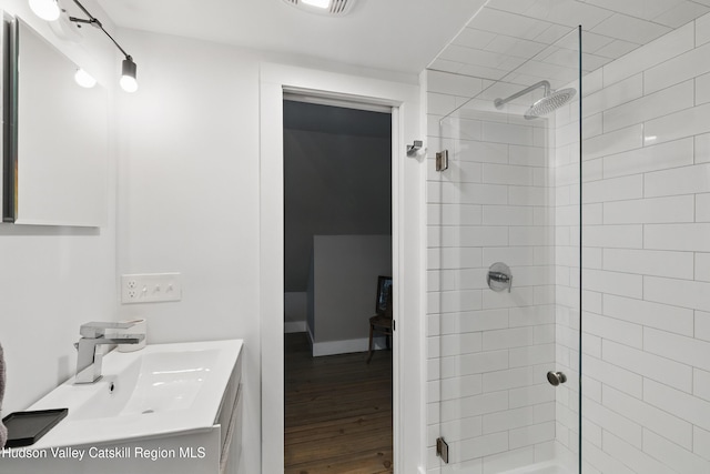 766 County Route 2, Accord, NY 12404 - bathroom featuring tiled shower, vanity, and wood finished floors