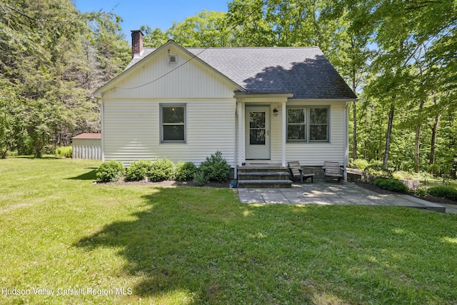 766 County Route 2, Accord, NY 12404 - view of front of home featuring a chimney, a front lawn, roof with shingles, a patio, and entry steps