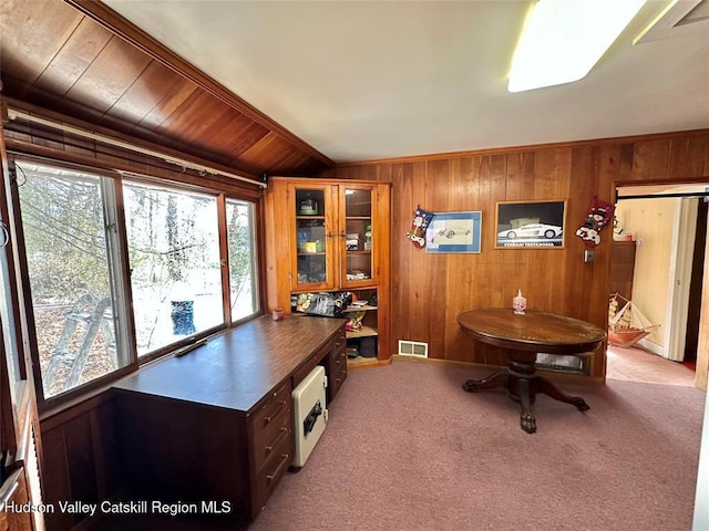 carpeted home office with wooden walls, vaulted ceiling, and wooden ceiling