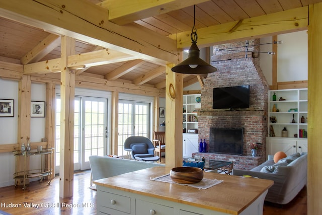 23 Raccoon Forks Rd, Old Chatham, NY 12136 - living room featuring wooden ceiling, wood finished floors, and a brick fireplace