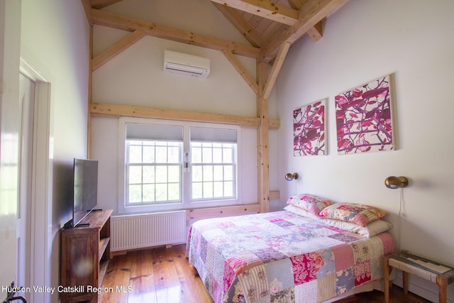 23 Raccoon Forks Rd, Old Chatham, NY 12136 - bedroom featuring radiator, a baseboard radiator, beam ceiling, hardwood / wood-style flooring, and an AC wall unit
