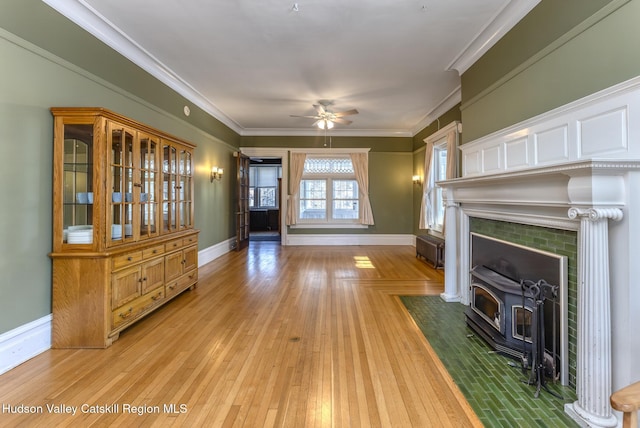 living room featuring ornamental molding, light hardwood / wood-style floors, and ceiling fan