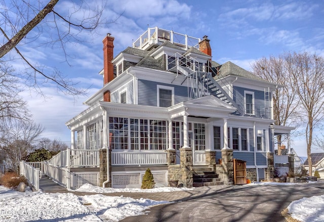 view of front of property featuring a sunroom