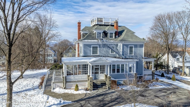 victorian house featuring a porch