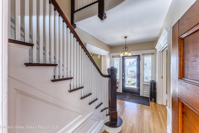 foyer entrance with hardwood / wood-style flooring