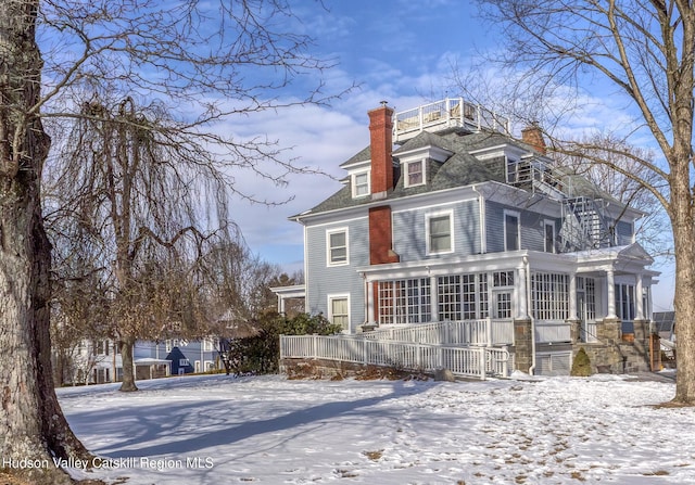 view of snow covered property