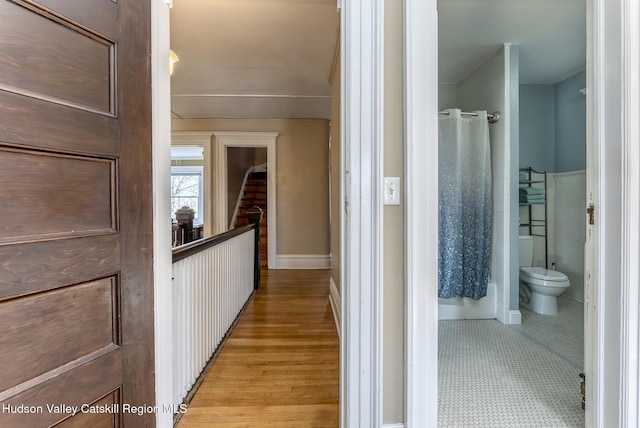 hall with light wood-type flooring