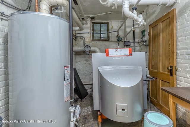 utility room featuring water heater