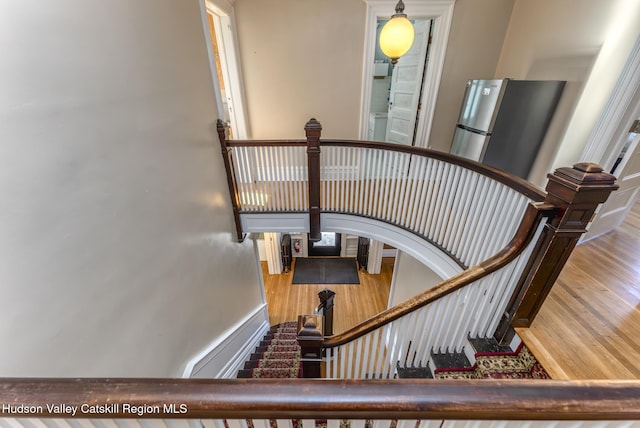 stairs with wood-type flooring