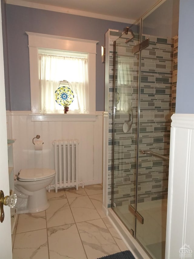 19 Aitken Ave, Hudson, NY 12534 - bathroom featuring radiator, a stall shower, toilet, marble finish flooring, and wainscoting