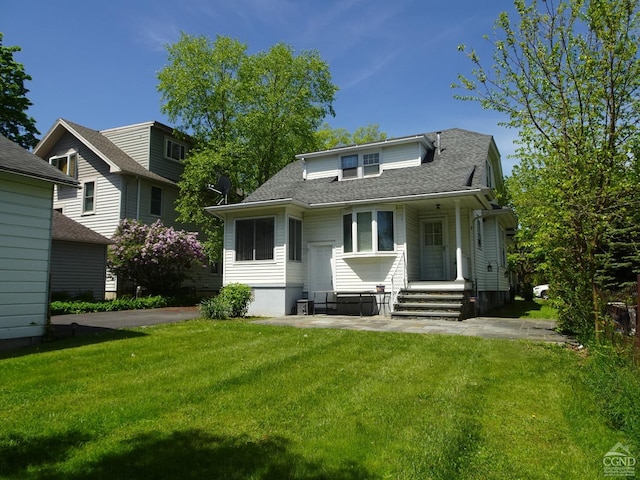19 Aitken Ave, Hudson, NY 12534 - back of property with a lawn and a shingled roof