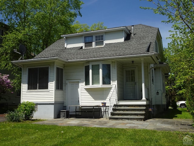19 Aitken Ave, Hudson, NY 12534 - bungalow-style house featuring roof with shingles, a front yard, entry steps, and a patio