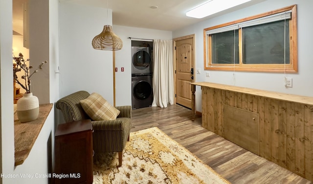 927 Queens Hwy, Accord, NY 12404 - sitting room with stacked washer / drying machine and wood finished floors