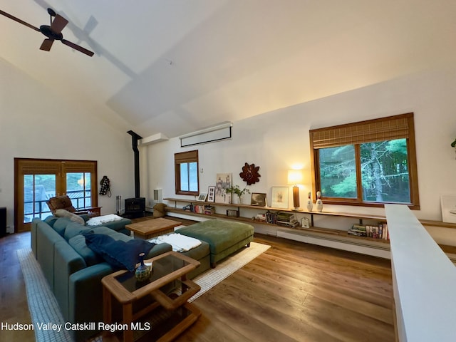 927 Queens Hwy, Accord, NY 12404 - living area featuring a wood stove, high vaulted ceiling, wood finished floors, baseboard heating, and a ceiling fan