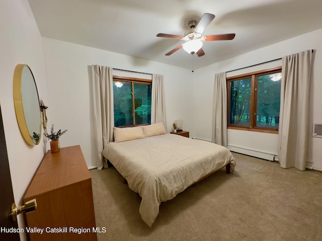 927 Queens Hwy, Accord, NY 12404 - bedroom featuring light colored carpet, baseboard heating, and a ceiling fan