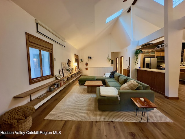 927 Queens Hwy, Accord, NY 12404 - living room featuring a skylight, wood finished floors, high vaulted ceiling, and a ceiling fan