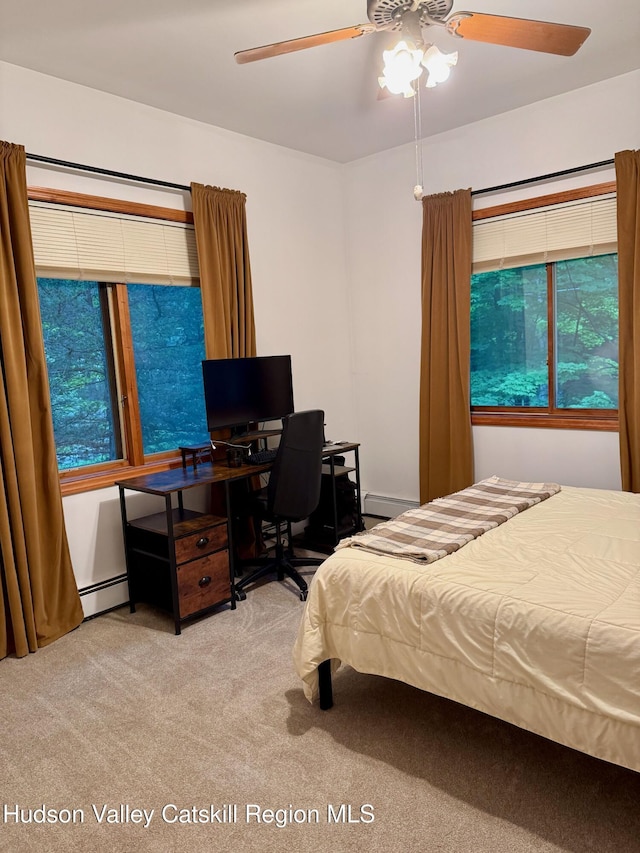 927 Queens Hwy, Accord, NY 12404 - carpeted bedroom with baseboard heating, multiple windows, and ceiling fan