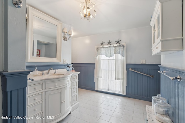 272 Main St, Middleburgh, NY 12122 - bathroom with a wainscoted wall, tile patterned floors, and vanity