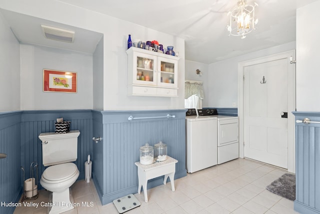272 Main St, Middleburgh, NY 12122 - bathroom featuring independent washer and dryer, tile patterned floors, wainscoting, and a chandelier