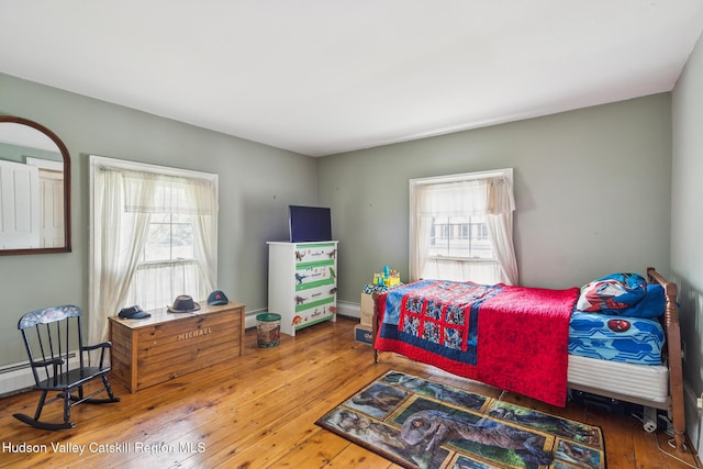 272 Main St, Middleburgh, NY 12122 - bedroom with hardwood / wood-style flooring and baseboard heating