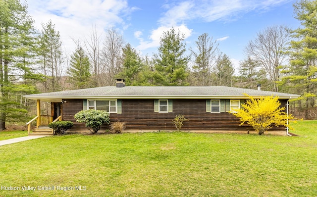 ranch-style home with a front lawn