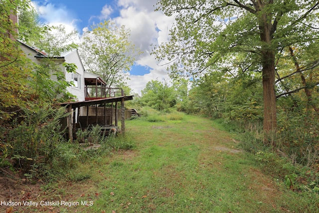 view of yard with a deck