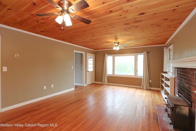 unfurnished living room with crown molding, light hardwood / wood-style flooring, and wood ceiling