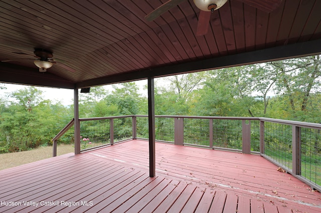 wooden deck featuring ceiling fan