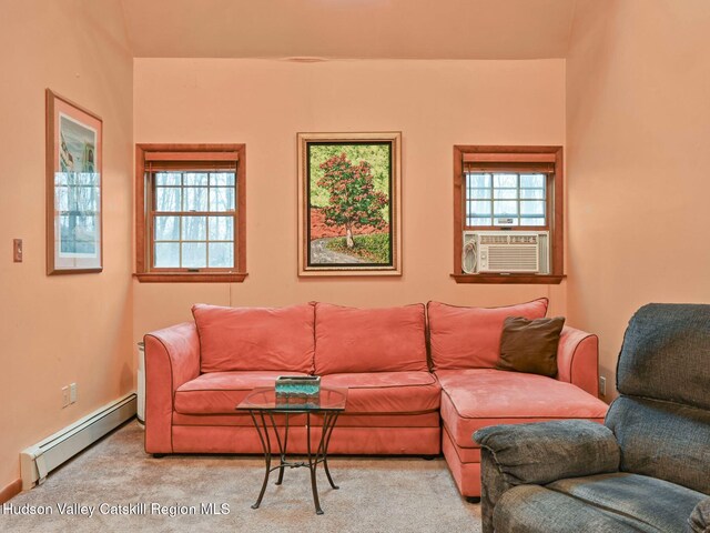 carpeted living room featuring baseboard heating, a wealth of natural light, and cooling unit