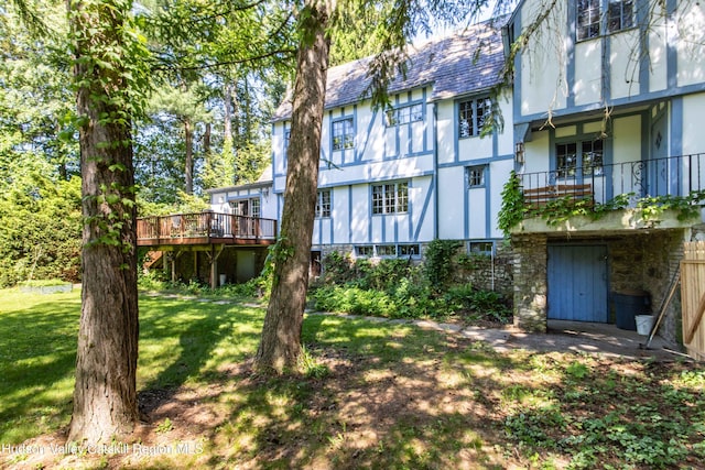 2 Malden Ave, Saugerties, NY 12477 - rear view of house with a lawn, stucco siding, and a wooden deck