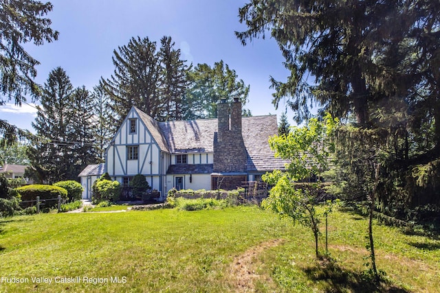 2 Malden Ave, Saugerties, NY 12477 - english style home featuring a front lawn and a chimney