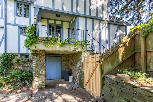 2 Malden Ave, Saugerties, NY 12477 - property entrance featuring stucco siding and a balcony