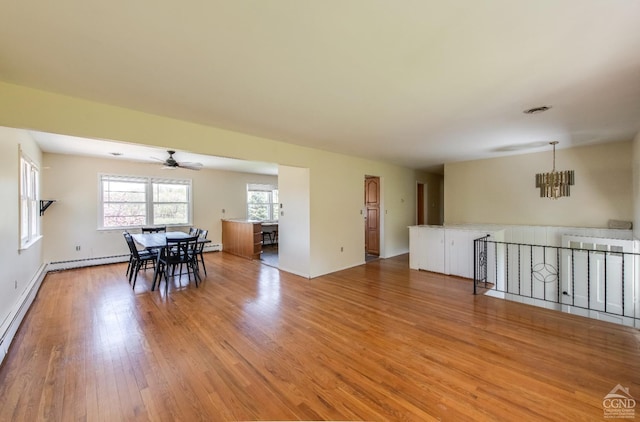 1536 State Route 213, Marbletown, NY 12440 - dining room featuring a chandelier, a ceiling fan, light wood finished floors, a baseboard heating unit, and baseboard heating
