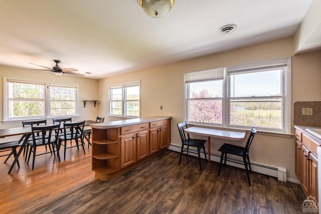 1536 State Route 213, Marbletown, NY 12440 - kitchen with baseboard heating, open shelves, dark wood-style floors, brown cabinets, and a peninsula