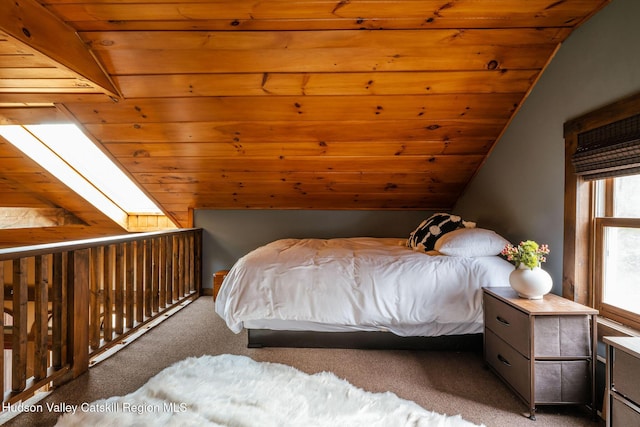 carpeted bedroom featuring vaulted ceiling and wood ceiling