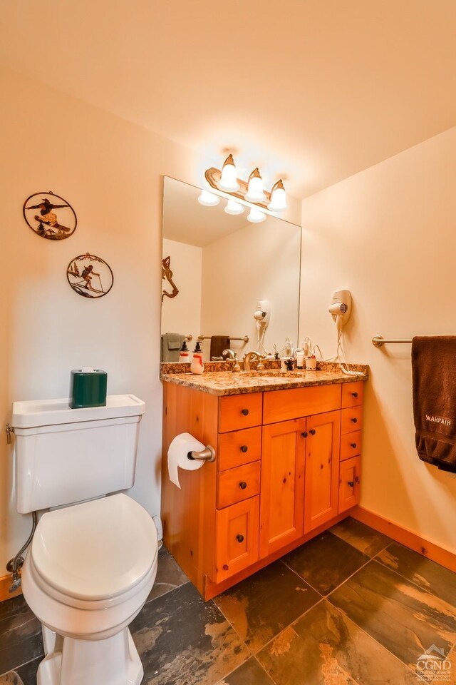 90 Club Rd, Windham, NY 12496 - bathroom with toilet, vanity, and baseboards