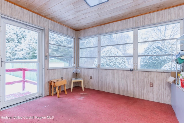 sunroom featuring wooden ceiling and plenty of natural light