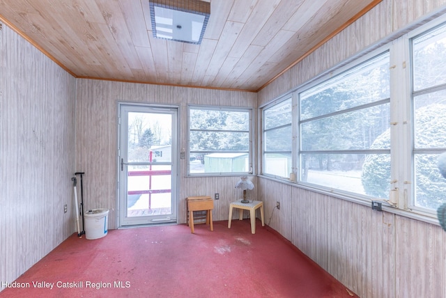 unfurnished sunroom with wooden ceiling