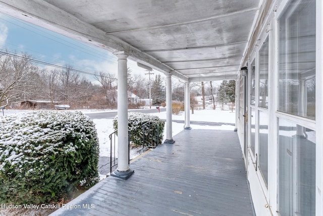 view of snow covered deck