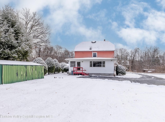 view of snow covered house