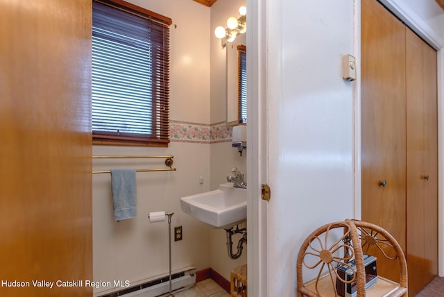 bathroom featuring sink and baseboard heating