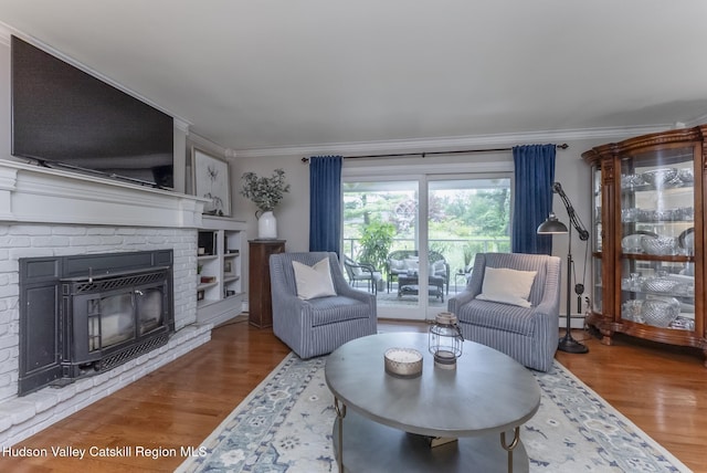 157 Hillside Ter, Kingston, NY 12401 - living room with wood finished floors, a fireplace, ornamental molding, and a baseboard radiator