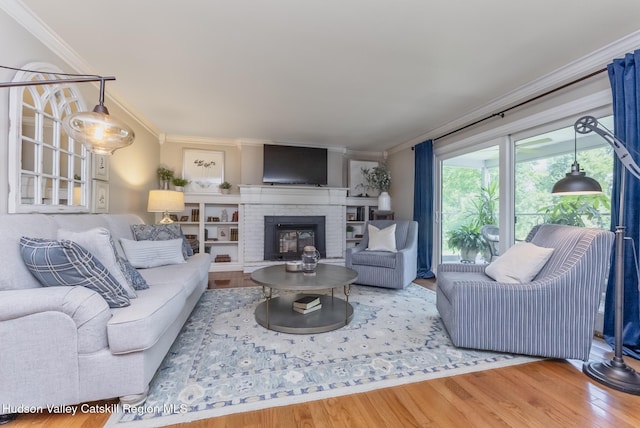 157 Hillside Ter, Kingston, NY 12401 - living room with ornamental molding, wood finished floors, and a brick fireplace